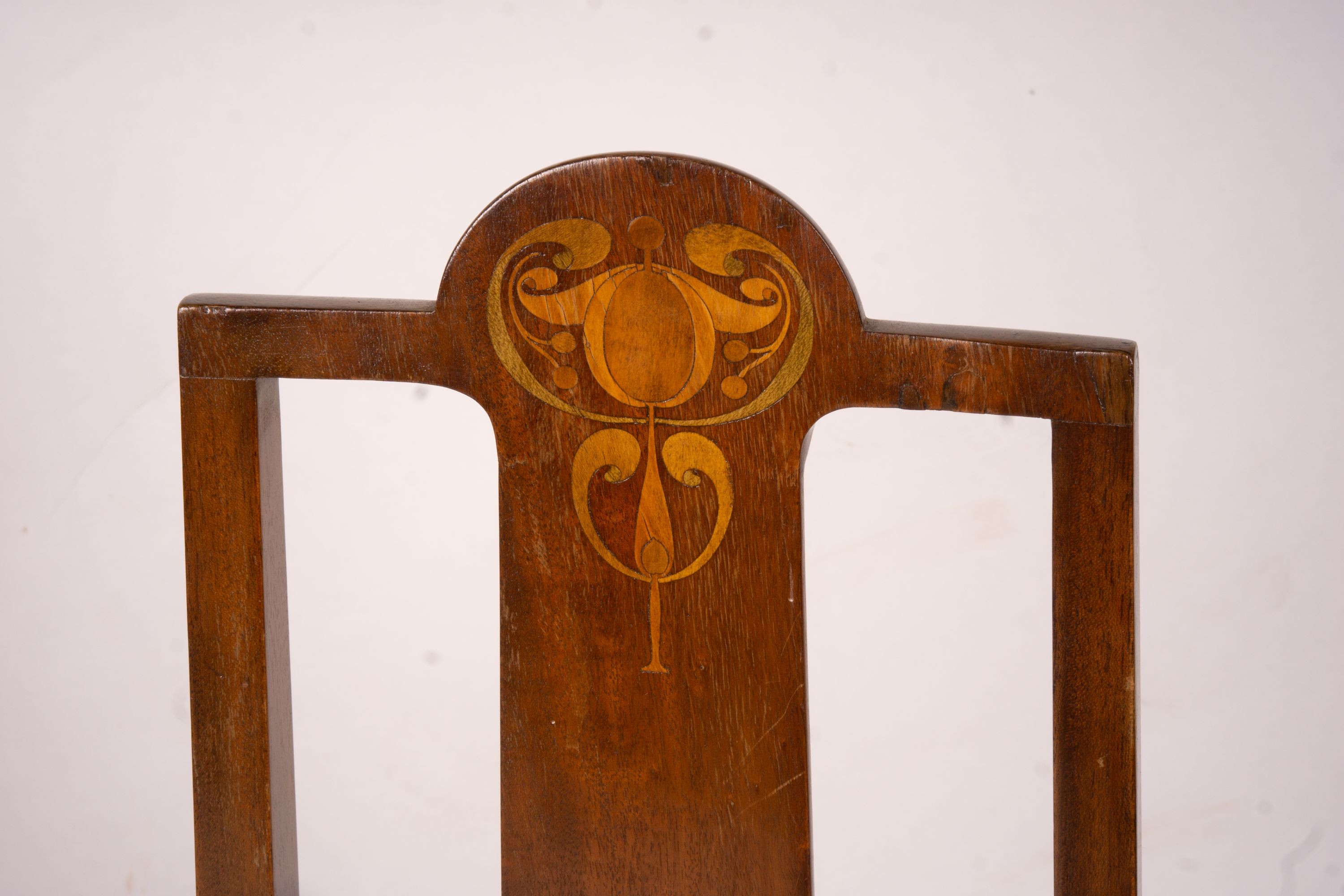 An Edwardian Art Nouveau inlaid mahogany towel rail and a pair of matching salon chairs (3)